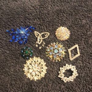 Entire lot of vintage rhinestone pins.